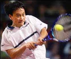 Michael Chang, of Mercer Island, Washington makes a return to Germany's Rainer Schuettler in their first round match at the ATP tennis tournament in the Hanns Martin Schleyer indoor arena in Stuttgart, Germany, Monday Oct. 25, 1999. (AP Photo/Thomas Kienzle)